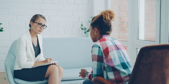 Woman talking with her therapist during an outpatient counseling session